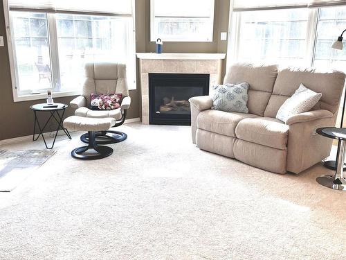 101 17150 94A Avenue, Edmonton, AB - Indoor Photo Showing Living Room With Fireplace