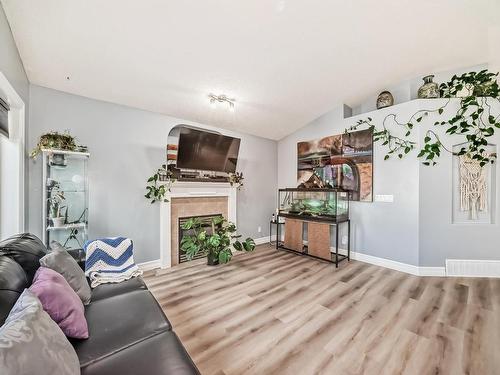 1367 117, Edmonton, AB - Indoor Photo Showing Living Room With Fireplace