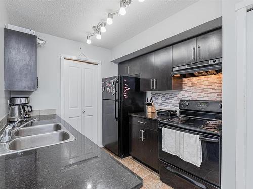 414 5390 Chappelle Road, Edmonton, AB - Indoor Photo Showing Kitchen With Double Sink