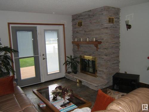 5621 48 Street, Vegreville, AB - Indoor Photo Showing Living Room With Fireplace