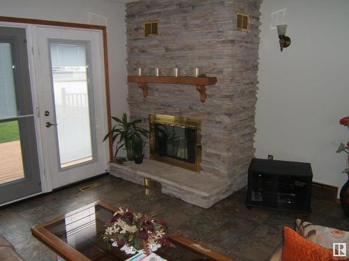 5621 48 Street, Vegreville, AB - Indoor Photo Showing Living Room With Fireplace