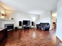 71 10909 106 Street, Edmonton, AB  - Indoor Photo Showing Living Room With Fireplace 