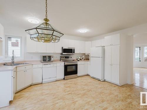 8021 17A Avenue, Edmonton, AB - Indoor Photo Showing Kitchen With Double Sink