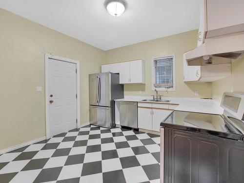 10722 92 Street, Edmonton, AB - Indoor Photo Showing Kitchen With Double Sink