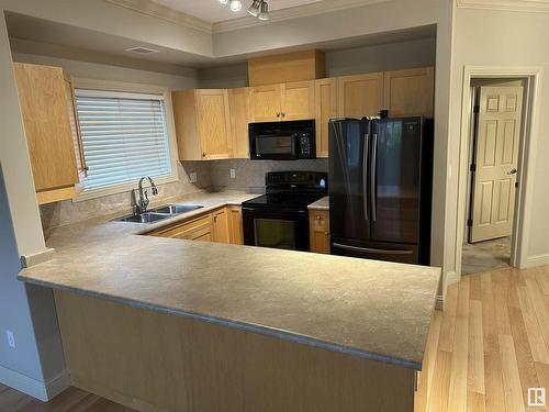 112 14612 125 Street, Edmonton, AB - Indoor Photo Showing Kitchen With Double Sink