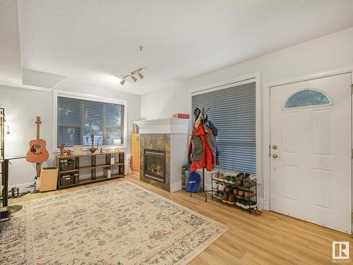 8028 109 Street, Edmonton, AB - Indoor Photo Showing Living Room With Fireplace