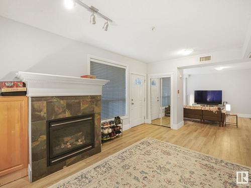 8028 109 Street, Edmonton, AB - Indoor Photo Showing Living Room With Fireplace