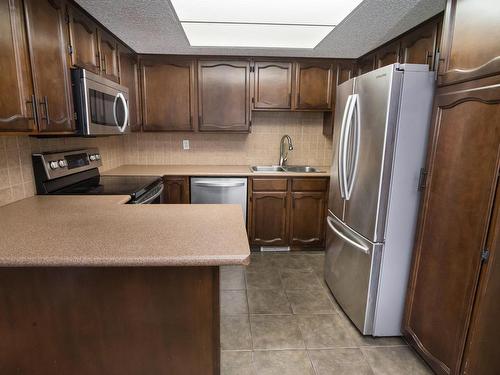 2730 136A Avenue, Edmonton, AB - Indoor Photo Showing Kitchen With Stainless Steel Kitchen With Double Sink