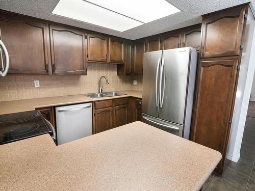 2730 136A Avenue, Edmonton, AB - Indoor Photo Showing Kitchen With Stainless Steel Kitchen With Double Sink