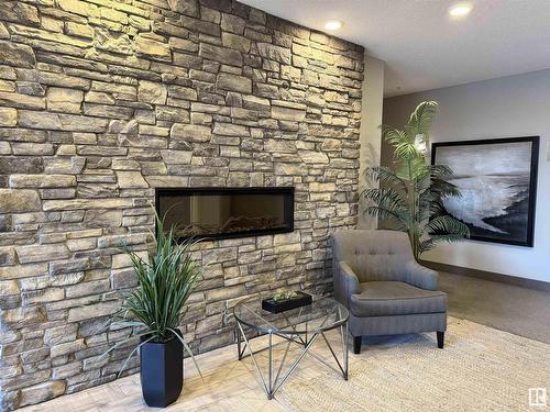 428 12804 140 Avenue, Edmonton, AB - Indoor Photo Showing Living Room With Fireplace