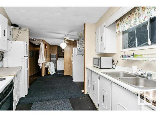 4705 54 Avenue, Calmar, AB - Indoor Photo Showing Kitchen With Double Sink