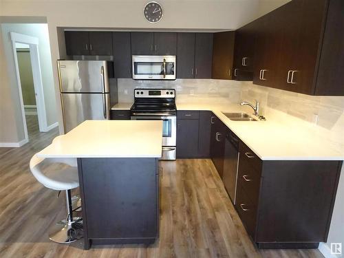 108 10518 113 Street, Edmonton, AB - Indoor Photo Showing Kitchen With Stainless Steel Kitchen With Double Sink