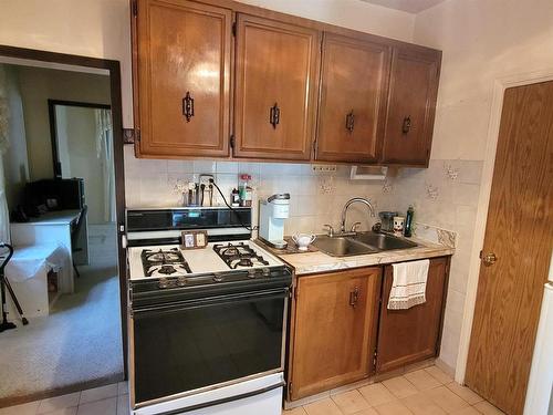 9229 110 Avenue, Edmonton, AB - Indoor Photo Showing Kitchen With Double Sink