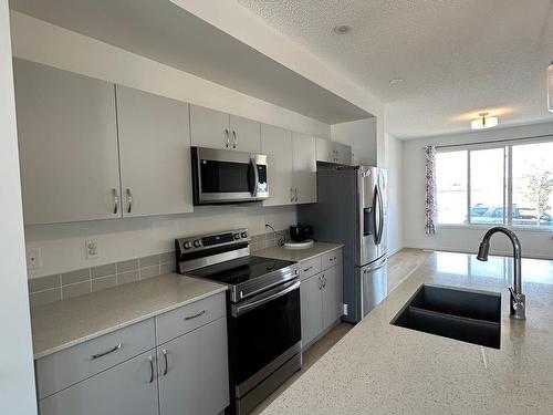 18007 71 Street, Edmonton, AB - Indoor Photo Showing Kitchen With Stainless Steel Kitchen With Double Sink