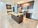 215 5510 Schonsee Drive, Edmonton, AB  - Indoor Photo Showing Kitchen With Stainless Steel Kitchen With Double Sink With Upgraded Kitchen 