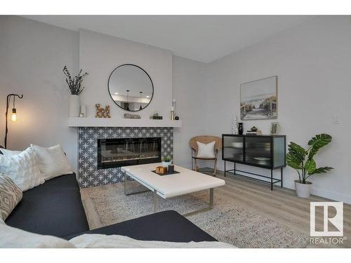 532 Bluff Lane, Leduc, AB - Indoor Photo Showing Living Room With Fireplace