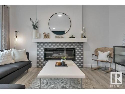 532 Bluff Lane, Leduc, AB - Indoor Photo Showing Living Room With Fireplace