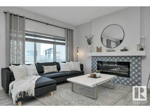 532 Bluff Lane, Leduc, AB - Indoor Photo Showing Living Room With Fireplace