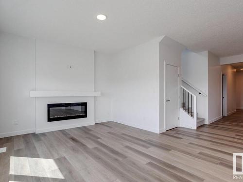 530 Bluff Lane, Leduc, AB - Indoor Photo Showing Living Room With Fireplace