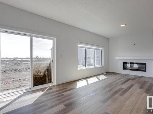 530 Bluff Lane, Leduc, AB - Indoor Photo Showing Living Room With Fireplace