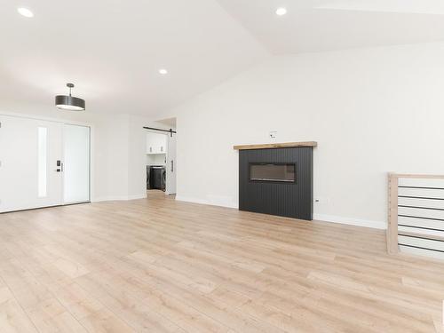 38 Heartwood Lane, Stony Plain, AB - Indoor Photo Showing Living Room With Fireplace