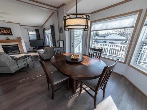 4916 56 Street, Rural Lac Ste. Anne County, AB - Indoor Photo Showing Dining Room With Fireplace