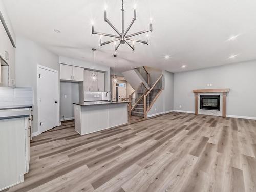 10206 92A Avenue, Morinville, AB - Indoor Photo Showing Kitchen With Fireplace