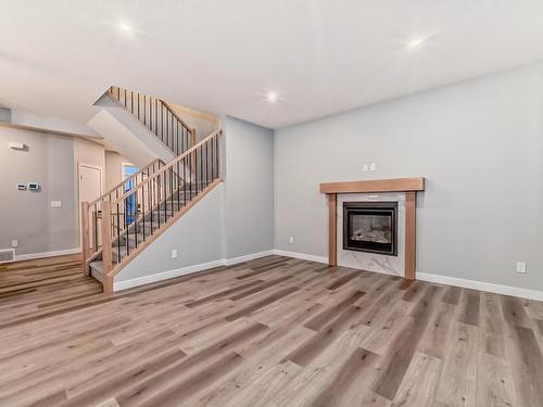 10206 92A Avenue, Morinville, AB - Indoor Photo Showing Other Room With Fireplace