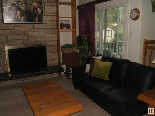 4405 52 Street, Vegreville, AB - Indoor Photo Showing Living Room With Fireplace