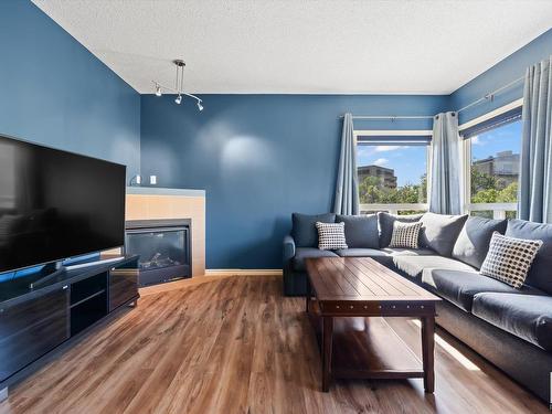 315 10235 112 Street, Edmonton, AB - Indoor Photo Showing Living Room With Fireplace