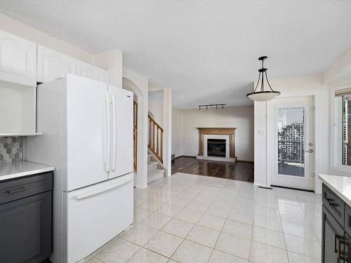 15936 59 Street, Edmonton, AB - Indoor Photo Showing Kitchen With Fireplace