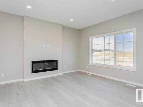 651 Kinglet Boulevard, Edmonton, AB - Indoor Photo Showing Living Room With Fireplace