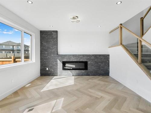 195 Ravine Drive, Devon, AB - Indoor With Fireplace