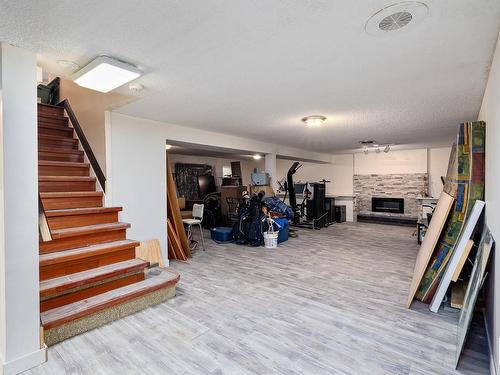 16 Quesnell Crescent, Edmonton, AB - Indoor Photo Showing Other Room With Fireplace