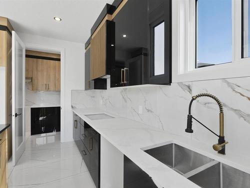 73 Astoria Point(E), Devon, AB - Indoor Photo Showing Kitchen With Double Sink