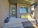 4404 Triomphe Close, Beaumont, AB  - Outdoor With Deck Patio Veranda With Exterior 