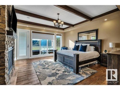 27209 Twp Road 512, Rural Parkland County, AB - Indoor Photo Showing Bedroom With Fireplace