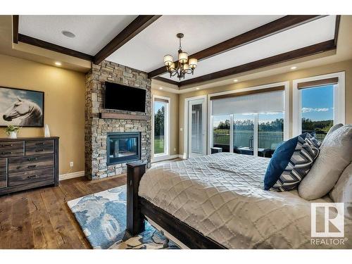 27209 Twp Road 512, Rural Parkland County, AB - Indoor Photo Showing Bedroom With Fireplace