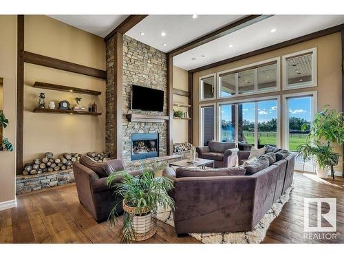 27209 Twp Road 512, Rural Parkland County, AB - Indoor Photo Showing Living Room With Fireplace