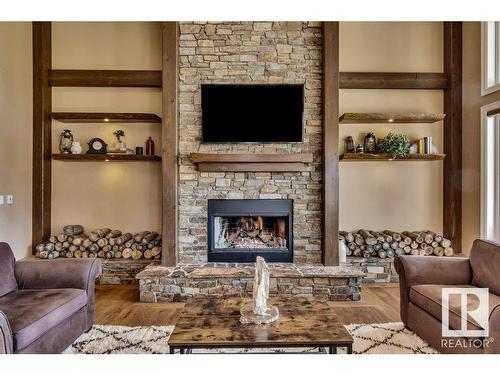 27209 Twp Road 512, Rural Parkland County, AB - Indoor Photo Showing Living Room With Fireplace