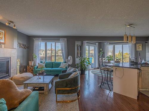 76 Dalquist Bay, Leduc, AB - Indoor Photo Showing Living Room With Fireplace