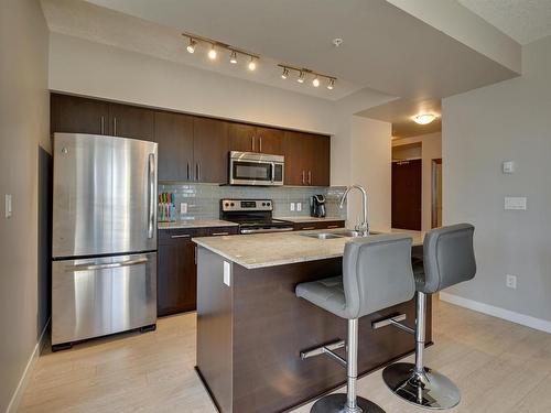 1006 10226- 104 Street Nw, Edmonton, AB - Indoor Photo Showing Kitchen With Stainless Steel Kitchen With Double Sink