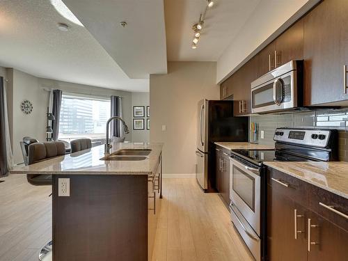 1006 10226- 104 Street Nw, Edmonton, AB - Indoor Photo Showing Kitchen With Stainless Steel Kitchen With Double Sink