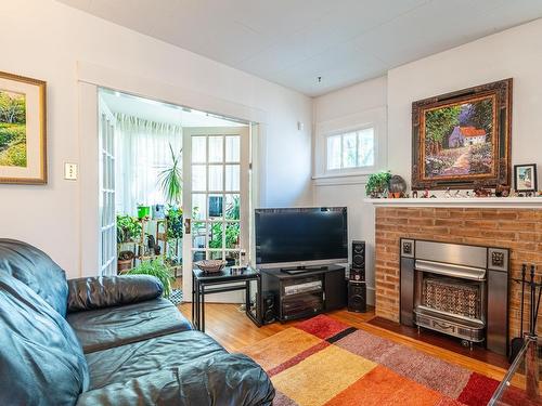 11646 94 Street, Edmonton, AB - Indoor Photo Showing Living Room With Fireplace