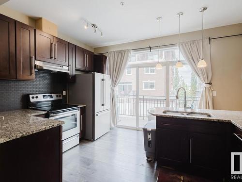 20 1623 Cunningham Way, Edmonton, AB - Indoor Photo Showing Kitchen With Double Sink