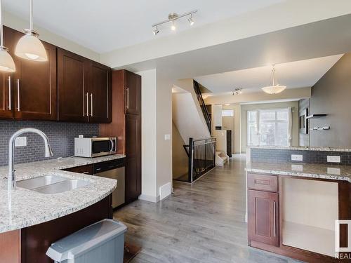 20 1623 Cunningham Way, Edmonton, AB - Indoor Photo Showing Kitchen With Double Sink