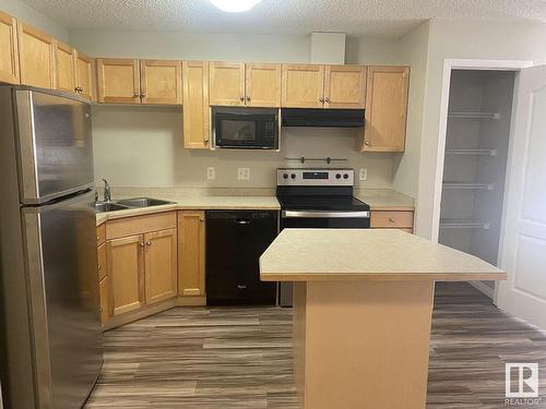 122 9525 162 Avenue, Edmonton, AB - Indoor Photo Showing Kitchen With Stainless Steel Kitchen With Double Sink