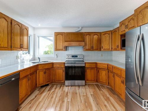 6 Bonin Place, Leduc, AB - Indoor Photo Showing Kitchen With Double Sink