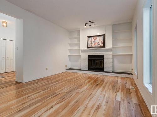 6 Bonin Place, Leduc, AB - Indoor Photo Showing Living Room With Fireplace