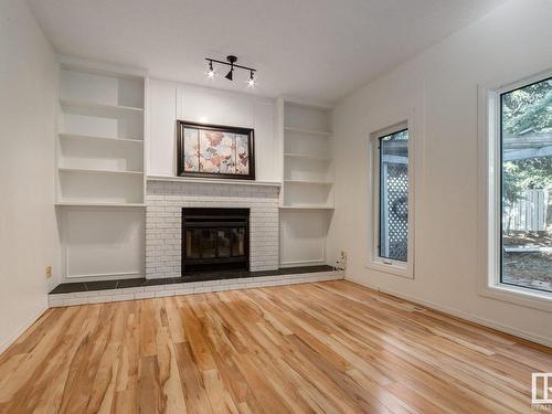 6 Bonin Place, Leduc, AB - Indoor Photo Showing Living Room With Fireplace